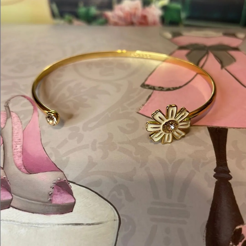 Coach Gold Tone Flower Bracelet with Rhinestone Accents.
